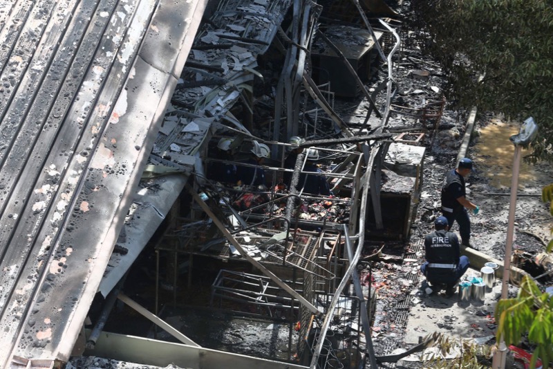 SCDF and Fire Investigation team seen at the scene of a wet market in Block 493 Jurong West Street 41 was destroyed in a fire which started about 2.45am and put out by 4.15am on Oct 11, 2016.  u00e2u20acu201d Photo by Koh Mui Fong/TODAY 