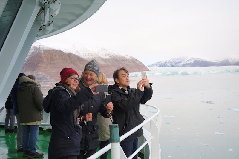 Visitors take pictures of a glacier in the Kongsfjorden fjord from onboard the Polarsyssel, the ship of the Governor of Svalbard, in the Arctic archipelago of Svalbard, Norway, September 20, 2016. u00e2u20acu201d Reuters pic
