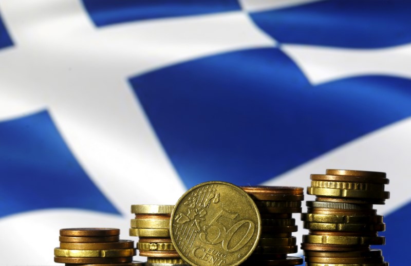 Euro coins are seen in front of a displayed Greece flag in this picture illustration, June 29, 2015. u00e2u20acu201d Reuters pic