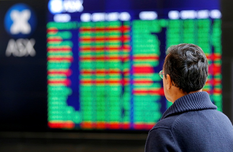 An investor looks at a board displaying stock prices at the Australian Securities Exchange (ASX) in Sydney October 14, 2016. u00e2u20acu201d Reuters pic