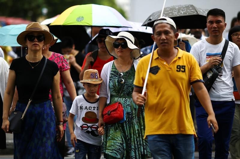 Chinese tourists cross a street near the Grand Palace in Bangkok, Thailand October 3, 2016. u00e2u20acu201d Reuters pic