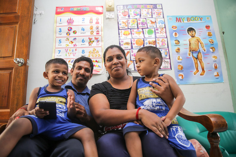 JMB committee member S. Balan with his wife, K. Puspharani, and their two sons inside their unit at Desa Mentari Block 3.