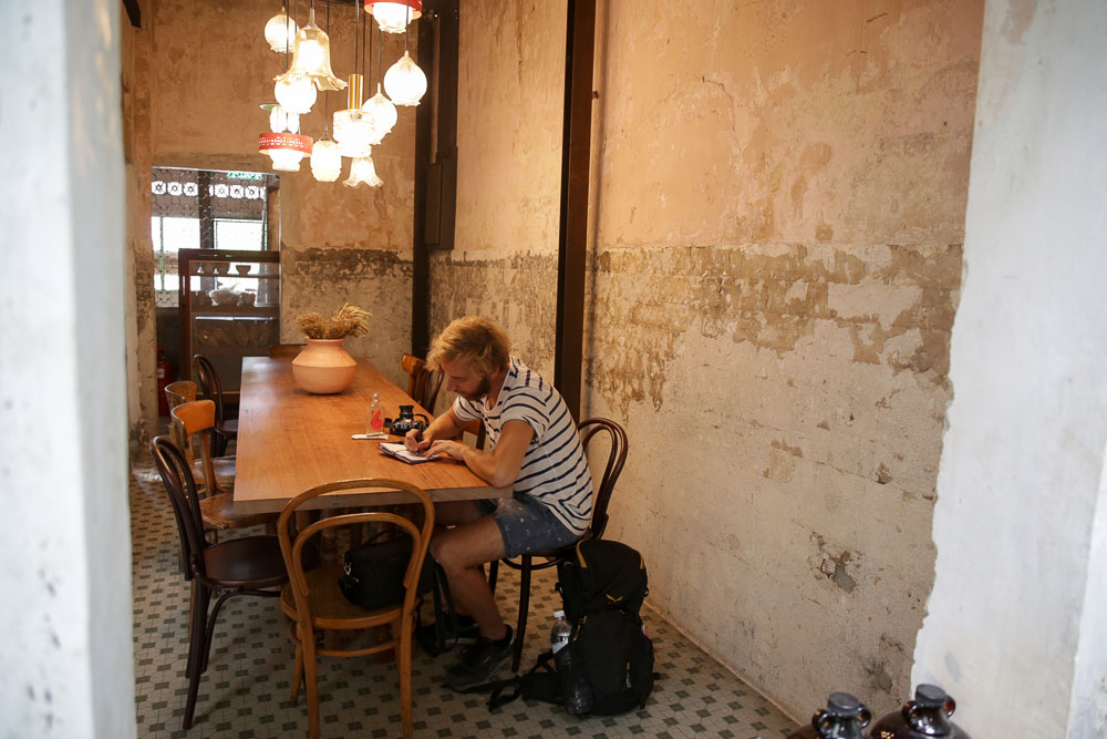 The raw concrete walls of the former Mah Lian Hotel still remain intact after the building was restored.