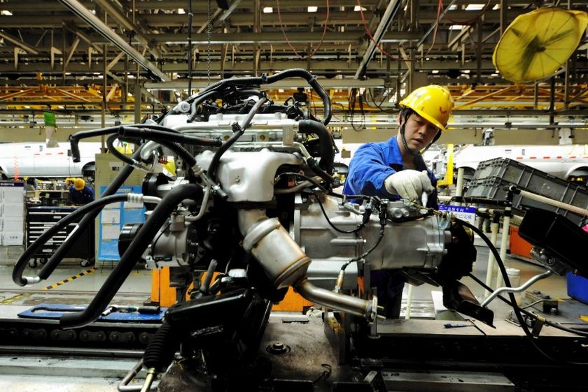 An employee works on an assembly line producing automobiles at a factory in Qingdao, Shandong Province, China, March 1, 2016. u00e2u20acu2022 Reuters pic