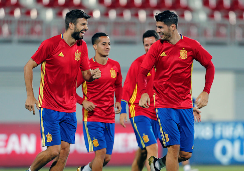Spain's Gerard Pique and Alvaro Morata take part in a training session. u00e2u20acu201d Reuters pic 