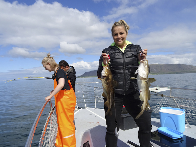 In an undated handout photo, Inga Osk Olafsdottir, a specialist in Icelandairu00e2u20acu2122s network control centre, with her catch during a fishing trip. u00e2u20acu201d Picture by Christine Negroni via The New York Times