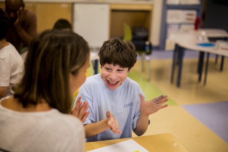 Nicholas Mir, who was born with microcephaly, works on a writing assignment with a teacher at Manhattan Star Academy in New York August 4, 2016. — Picture by Sam Hodgson/The New York Times