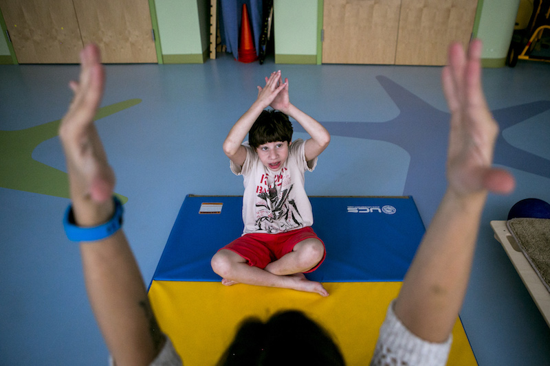 Nicholas Mir, who was born with microcephaly, during a physical therapy session with Allyson Perch at Manhattan Star Academy in New York August 4, 2016. — Picture by Sam Hodgson/The New York Times