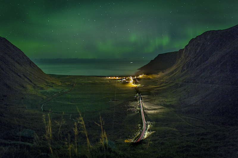 The Northern Lights colour the sky over the Norwegian Sea in Unstad, Norway, a remote town between two mountains in the Lofoten Islands, October 8, 2016. u00e2u20acu201d Picture by Leslye Davis/The New York Times
