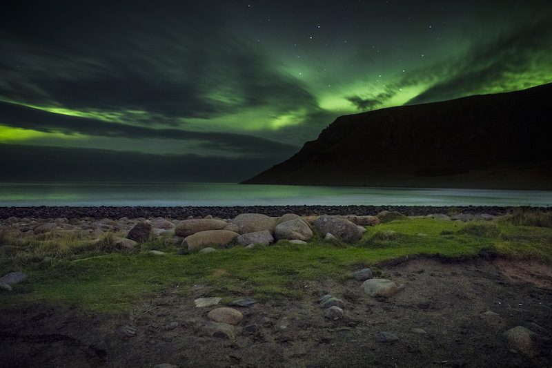 The Northern Lights colour the sky beyond the Norwegian Sea’s shoreline in Unstad, October 8, 2016. — Picture by Leslye Davis/The New York Times