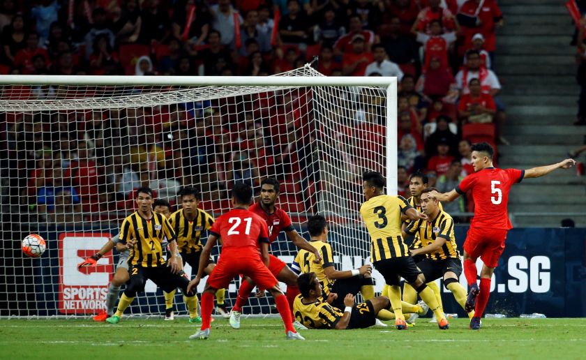 Singaporeu00e2u20acu2122s Baihakki Khaiza misses his shot in the match against Malaysian in Singapore, October 8, 2016. u00e2u20acu201d Reuters pic