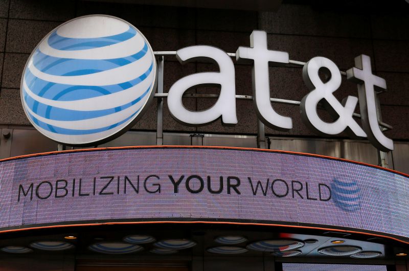 Signage for an AT&T store is seen in New York. u00e2u20acu2022 Reuters pic