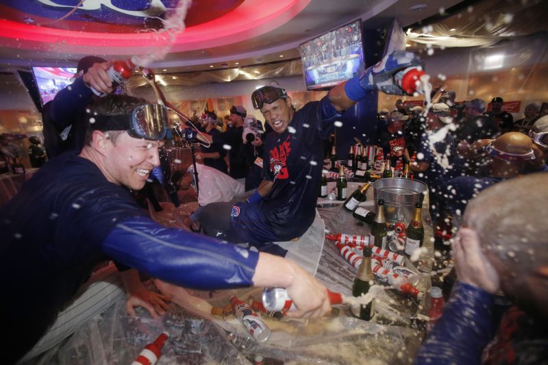 Oct 22, 2016; Chicago, Ilinois; Chicago Cubs shortstop Addison Russell (middle) celebrates in the clubhouse after defeating the Los Angeles Dodgers, game six, 2016 NLCS playoff baseball series at Wrigley Field. Mandatory Credit: Jon Durr-USA TODAY Sports