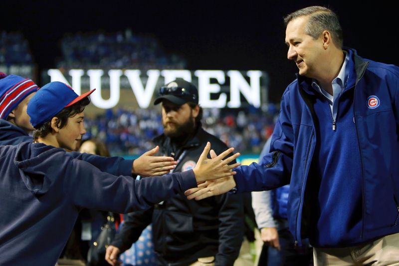 Cubs owner Tom Ricketts high fives fans in an early-season game. — Jerry Lai-USA TODAY Sports/Reuters pic
