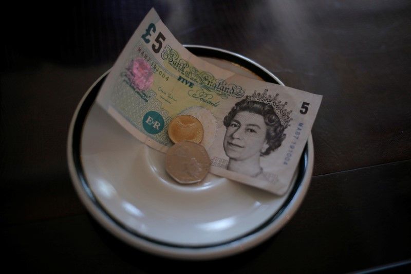 An English u00c2u00a35 note and coins are seen at a restaurant in the British overseas territory of Gibraltar in this picture released October 5, 2016. u00e2u20acu201d Reuters pic
