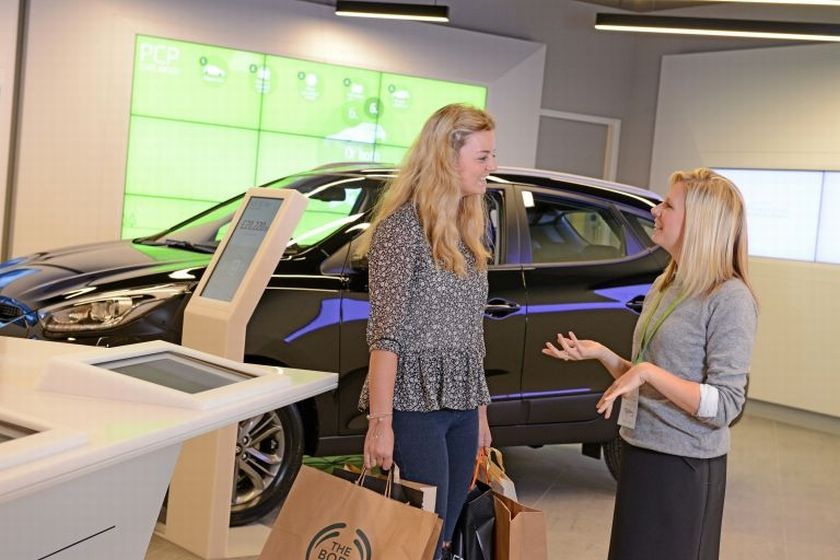 A Rocker Hyundai u00e2u20acu02dcAngelu00e2u20acu2122 assistnat greets a customer. u00e2u20acu2022 Afp-Relaxnews picn