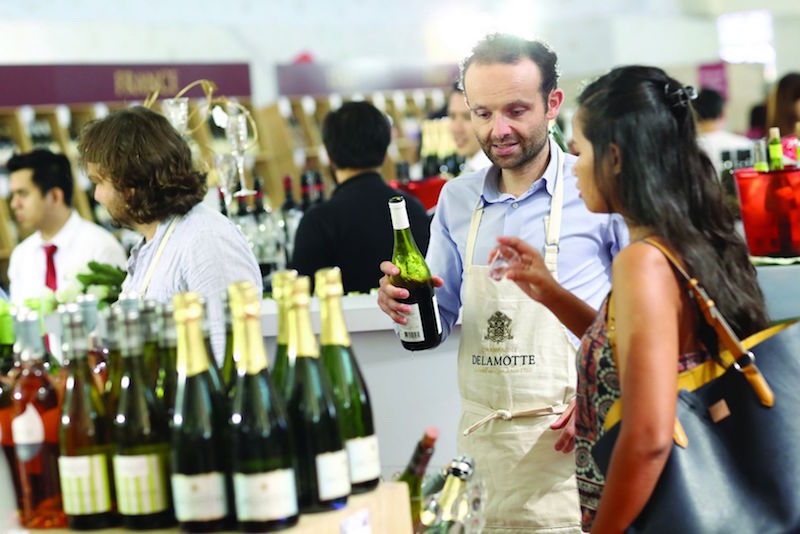 An international wine expert specially flown in for Cold Storage International Wine Fair shares about his wine with a shopper. u00e2u20acu201d Picture courtesy of Cold Storage 