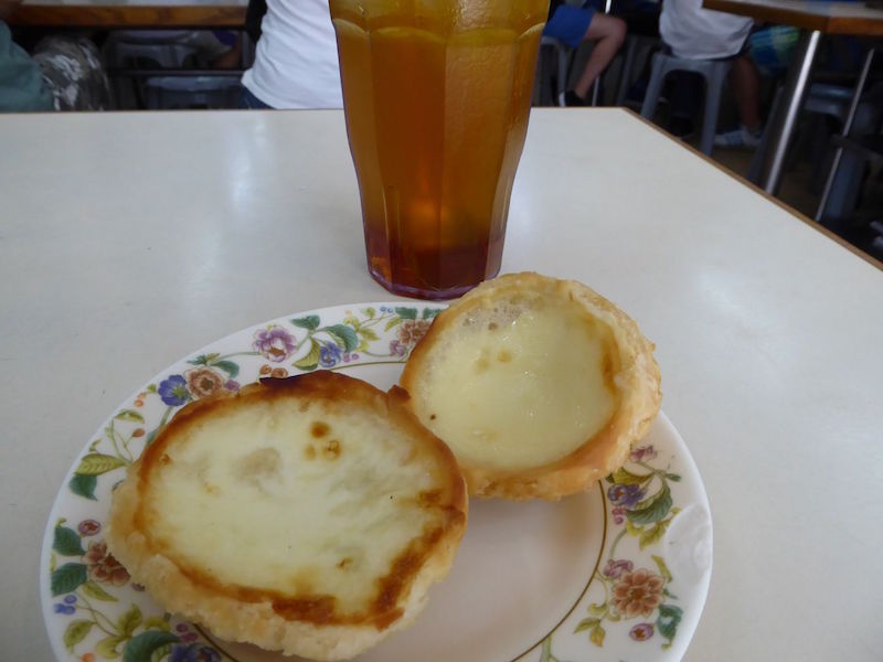 Eat your bird’s nest tart (left) and your milk tart from San Hou Lei with a cool glass of iced tea. — TODAY pic