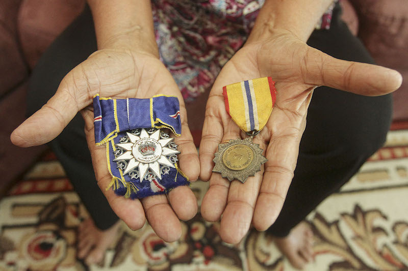 Koshy shows the Ahli Mangku Negara medal awarded by the Yang di-Pertuan Agong and the Pingat Jasa Kebaktian Melaka medal given by the Malacca government for her services as a police officer. — Picture by Yusof Mat Isa