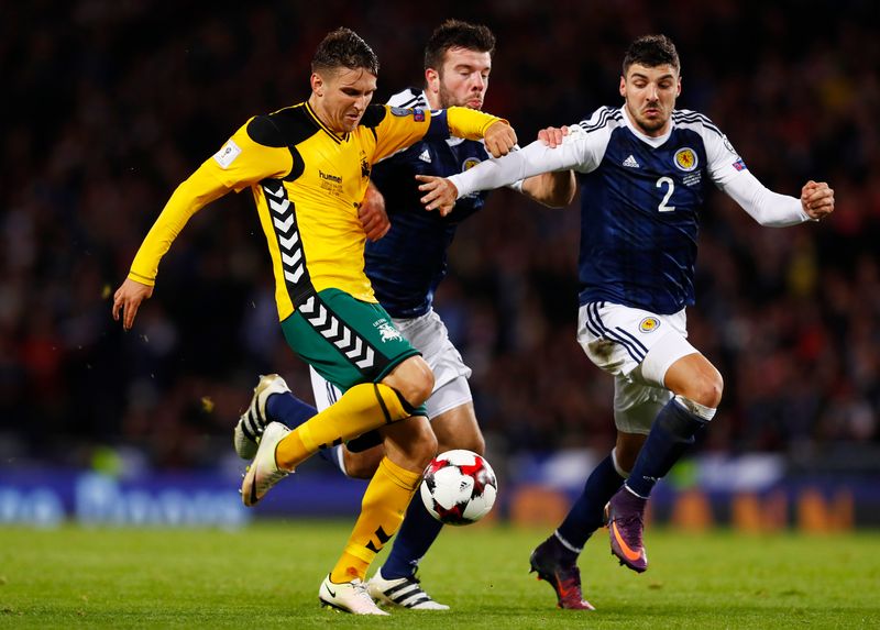 Lithuania's Fedor Chernykh (left) in action with Scotland's Callum Paterson in a World Cup qualifying group match ib Glasgow October 8, 2016. u00e2u20acu201d Reuters pic