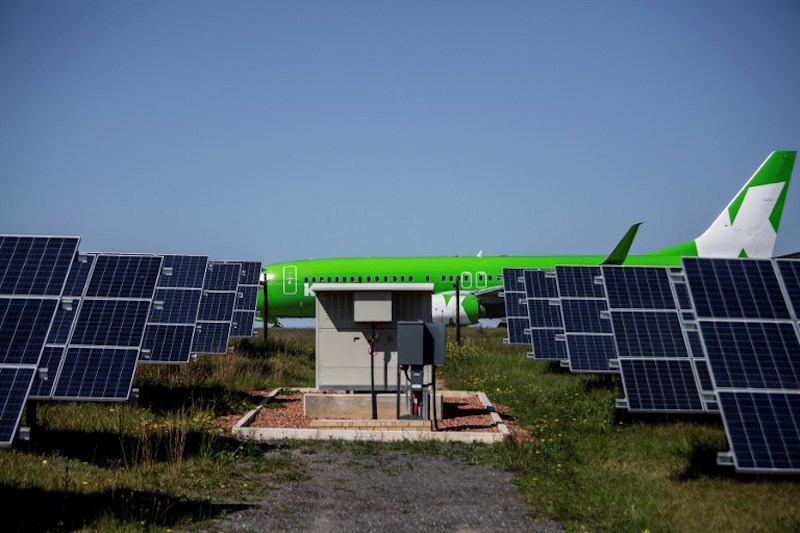 A passenger commercial aircraft taxis on the airportu00e2u20acu2122s runway before take off, as solar panels are seen in the foreground, in George, South Africa, September 26, 2016. u00e2u20acu201d AFP pic