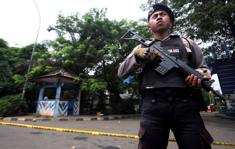 A policeman holds a rifle at location where a suspected supporter of Islamic State attacked policemen in Tangerang, Indonesia's Banten province, October 20, 2016. u00e2u20acu201d Reuters pic