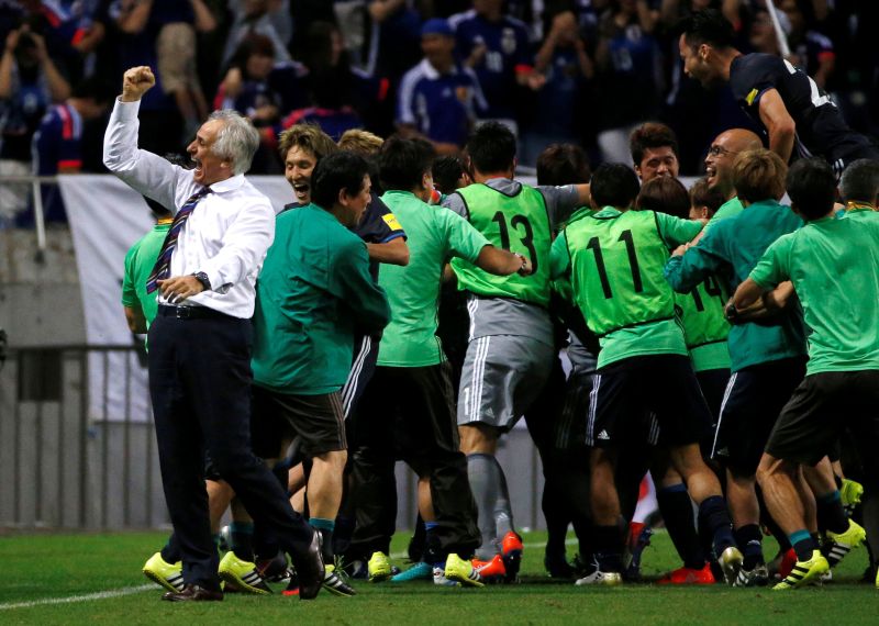 Japan's head coach Vahid Halilhodzic (left) celebrates with his team members after Japan's Hotaru Yamaguchi scored the second goal for Japan against Iraq. u00e2u20acu2022 Reuters pic