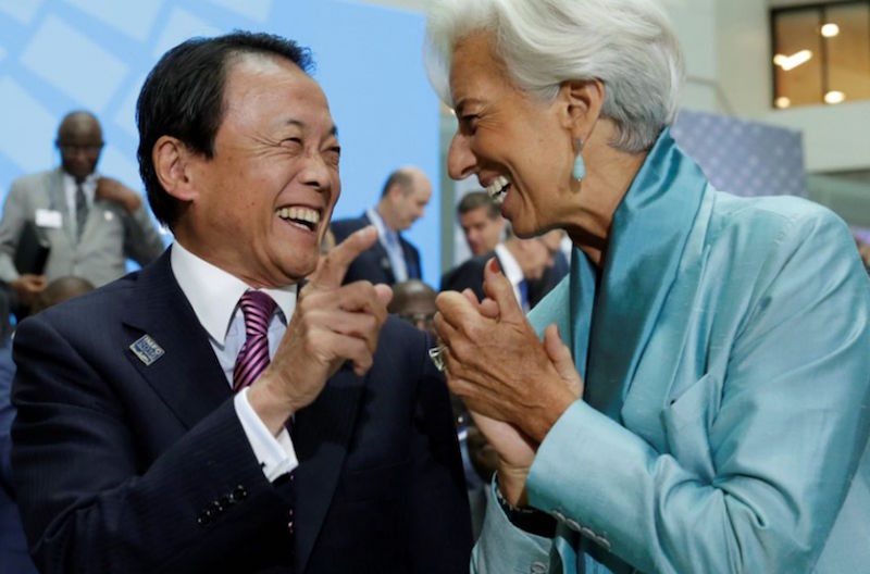 IMF Managing Director Christine Lagarde shares a laugh with Japanese Finance Minister Taro Aso in Washington October 8, 2016. u00e2u20acu201d Reuters pic