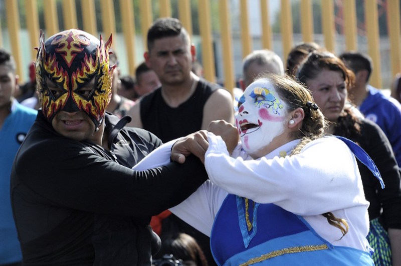 Mexican wrestler Polvora gives instructions while training local police in Iztapalapa neigbourhood in Mexico City, to help them subdue suspects without using weapons, on October 6, 2016. u00e2u20acu201d AFP pic