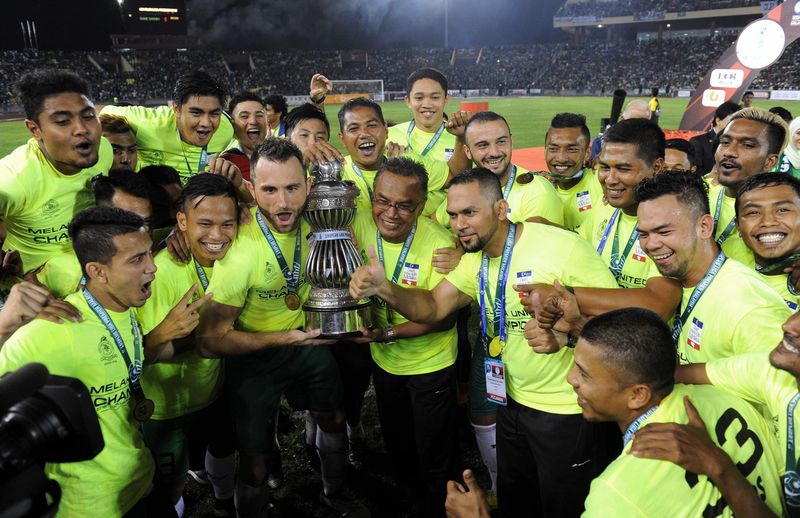Melaka United with the Premier League trophy for 2016 after the last match against Sime Darby at the Hang Jebat Stadium October 22, 2016. u00e2u20acu201d Bernama pic