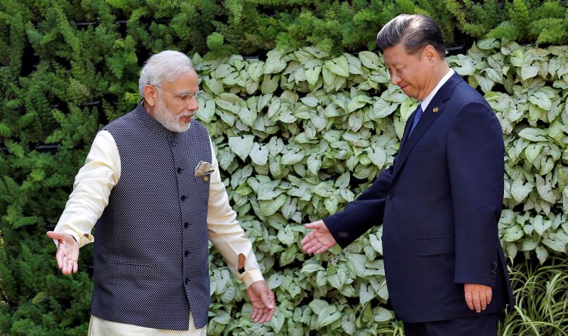 Indian Prime Minister Narendra Modi (L) and Chinese President Xi Jinping after the group picture at the BRICS (Brazil, Russia, India, China and South Africa) Summit in Benaulim, Goa, October 16, 2016. REUTERS/Danish Siddiqui