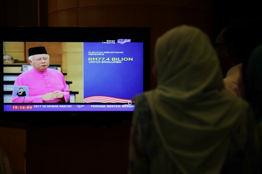 Government servants watch Datuk Seri Najib Razak table Budget 2017 at the Ministry of Finance, Putrajaya October 21, 2016. u00e2u20acu201d Picture by Choo Choy May