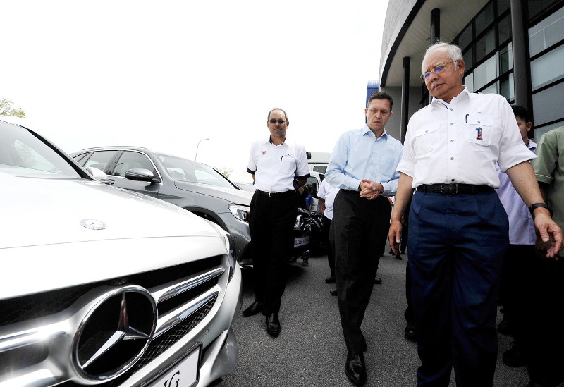 Prime Minister Datuk Seri Najib Razak (right) admiring a Mercedes-Benz car when launching the Mercedes-Benz assembly plant in the Pekan Automotive Park, October 15, 2016. He was accompanied by Mercedes-Benz Malaysia Sdn Bhd president, Dr Claus Weidner (ce