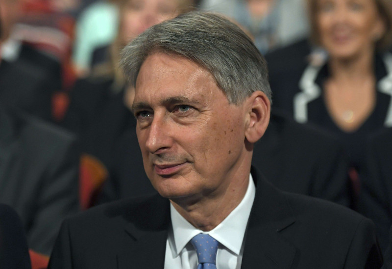 Britainu00e2u20acu2122s Chancellor Philip Hammond listens as Prime Minister Theresa May gives her speech on the final day of the annual Conservative Party Conference in Birmingham, Britain, October 5, 2016. u00e2u20acu201d Reuters pic
