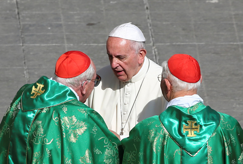 Pope Francis (centre) speaks with two cardinals before to leave at the end of a Marian vigil mass in Saint Peteru00e2u20acu2122s square at the Vatican, October 9, 2016. u00e2u20acu201d Reuters pic
