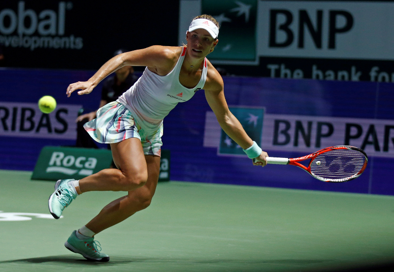 Angelique Kerber of Germany in action against Simona Halep of Romania during the Singapore WTA Finals round robin singles at the Singapore Indoor Stadium, Singapore October 25, 2016. u00e2u20acu201d Reuters pic