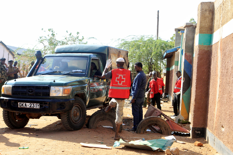 Kenya Red Cross workers and police officers stand near the scene of the destruction following an attack at the Bisharo lodging by Islamist militants from al-Shabaab in Mandera, Kenya October 25, 2016. u00e2u20acu201d Reuters pic