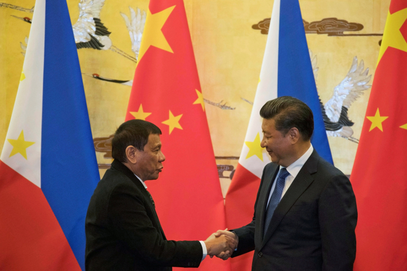 Philippines President Rodrigo Duterte (left) and Chinese President Xi Jinping shake hands after a signing ceremony held in Beijing, China October 20, 2016. u00e2u20acu201d Reuters pic