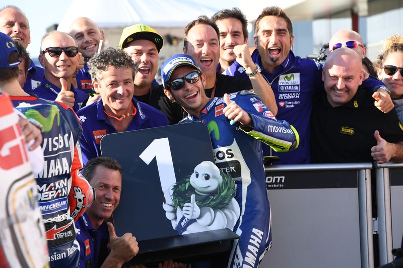 Movistar Yamaha MotoGP's Valentino Rossi (centre) celebrates with his team after taking pole position for the Japan Grand Prix MotoGP event in the Twin Ring Motegi circuit in Motegi October 15, 2016. u00e2u20acu201d AFP pic