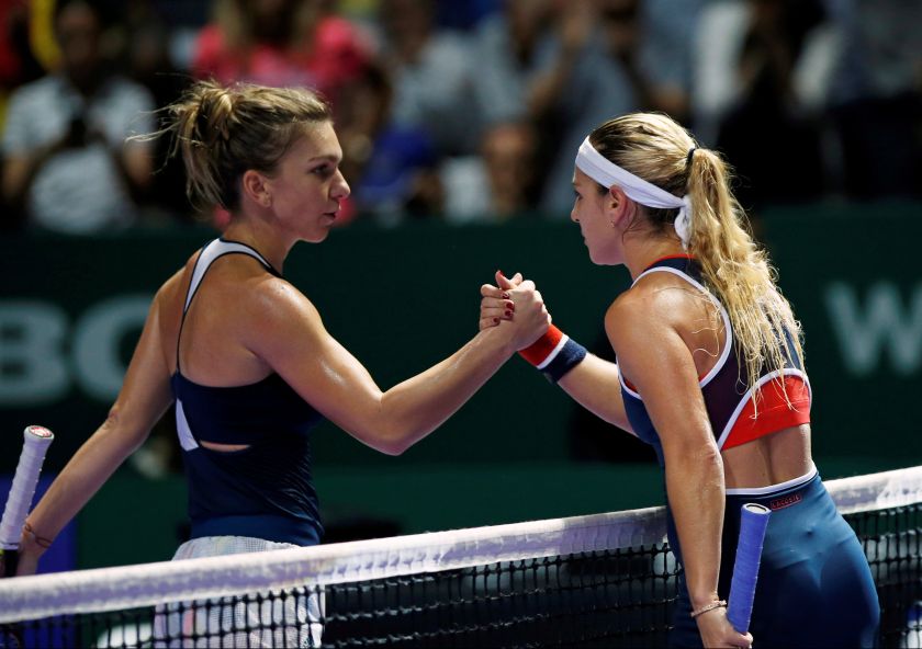 Simona Halep of Romania (left) congratulates Dominika Cibulkova of Slovakia after their match at the Singapore Indoor Stadium October 27, 2016. u00e2u20acu2022 Reuters pic