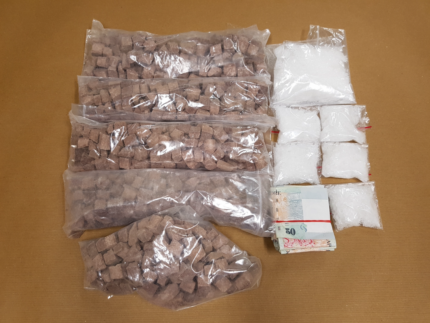 Heroin and u00e2u20acu02dcIceu00e2u20acu2122 and cash seized in CNB operation on 26 October 2016. u00e2u20acu201d Picture courtesy of CNB 