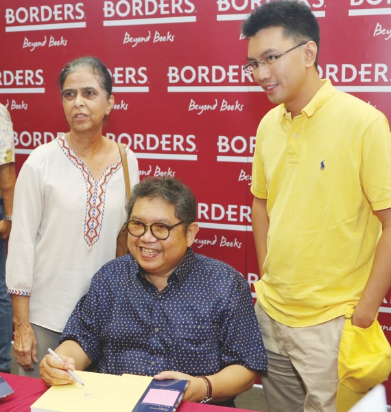 Eisenhower Fellows Datuk Hardev Kaur, Lat and the writer. — Picture by Tunku Zain Al-’Abidin