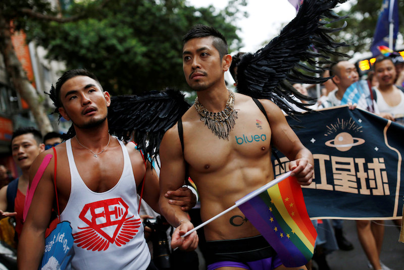 A participant holds a rainbow flag as he takes part in the lesbian, gay, bisexual and transgender (LGBT) pride parade in Taipei October 29, 2016. u00e2u20acu201d Reuters pic