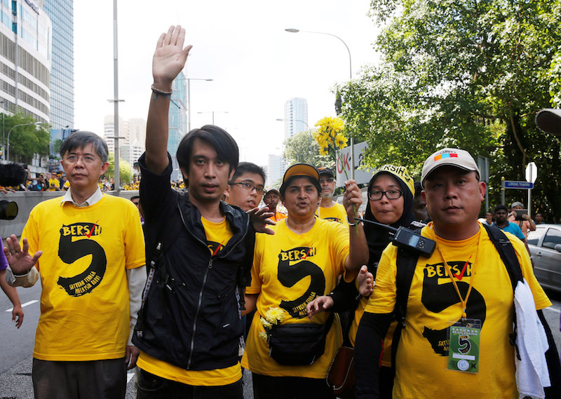 Adam Adli (second from left) has been on the frontlines of change-led protests. — Reuters pic