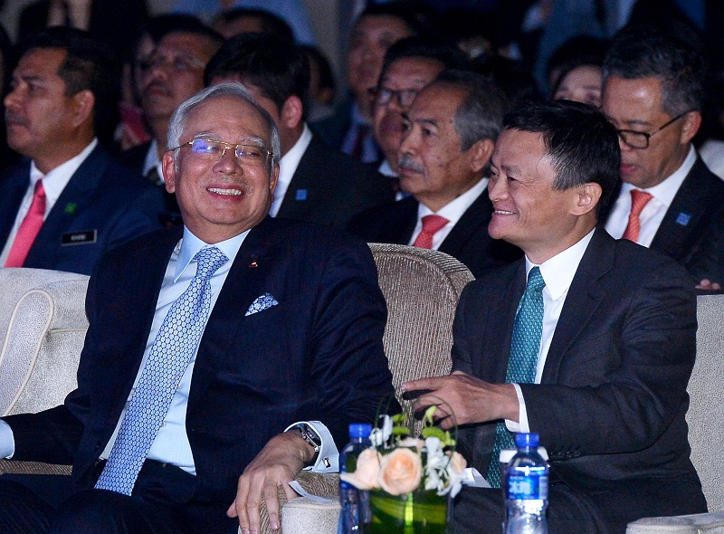 Prime Minister Datuk Seri Najib Razak having a light moment with Executive Chairman of Alibaba Group Jack Ma (right) during the launching ceremony of Alitrip Malaysia Tourism Pavilion in Beijing November 4, 2016. u00e2u20acu201d Bernama pic