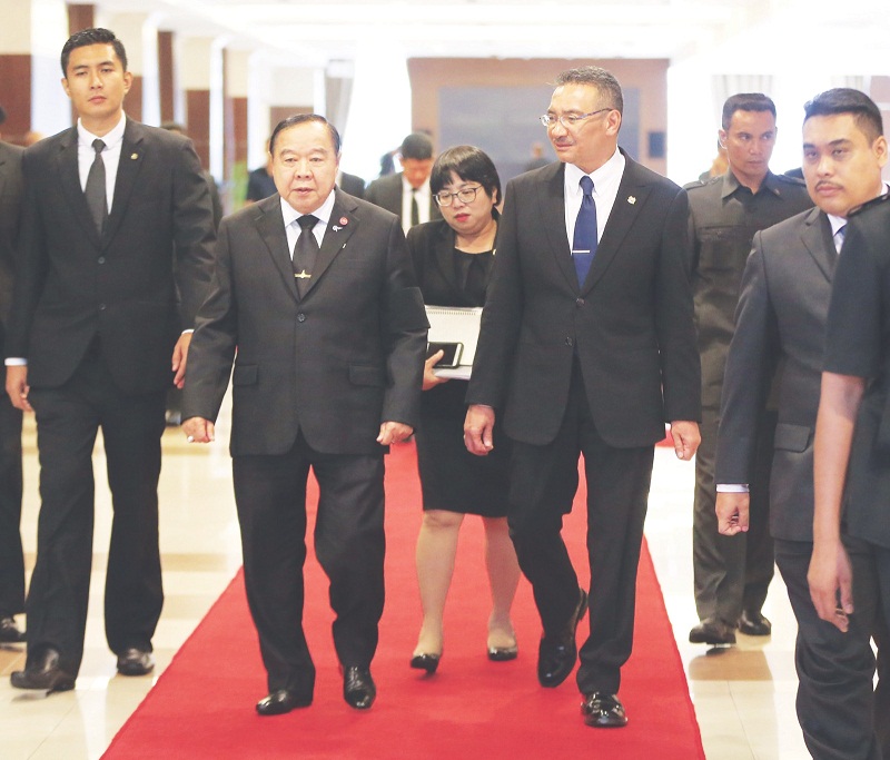 Defence Minister Datuk Seri Hishammuddin Hussein (right) and General Prawit Wongsuwon arrived for the meeting at Wisma Perwira. u00e2u20acu201d Picture by Razak Ghazali