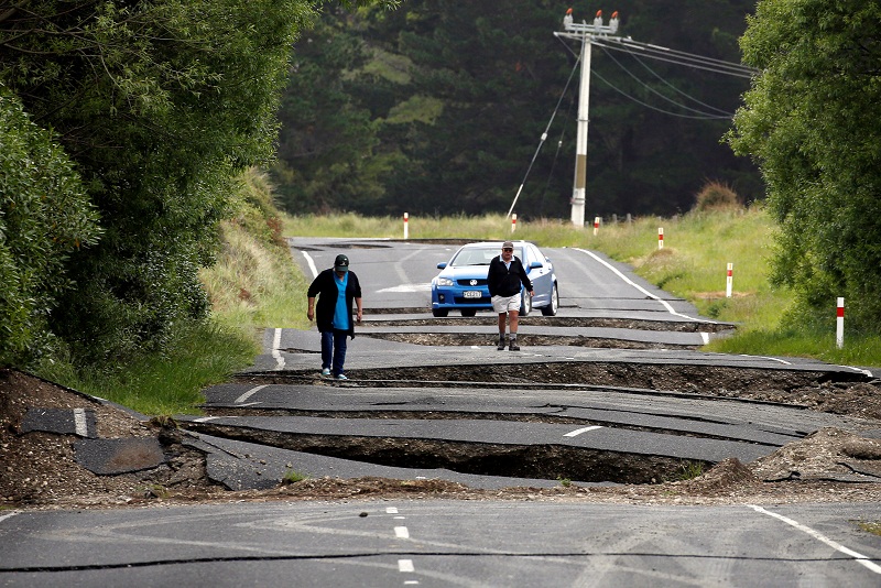 Local residents Chris and Viv Young look at damage caused by an earthquake along State Highway One near the town of Ward, south of Blenheim on New Zealand's South Island, November 14, 2016. u00e2u20acu201d Reuters pic