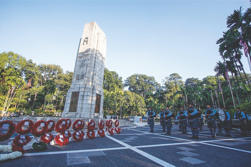 The KL Pipes and Drums band performs during the Rememberance Day ceremony at the Cenotaph near the National Monument yesterday. u00e2u20acu201d Picture by Hari Anggara