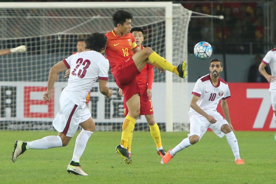 Zheng Zhi of China and Hassan Al Haidos of Qatar in action during the World Cup 2018 qualifier match in Kunming, China November 15, 2016. u00e2u20acu201d Reuters pic