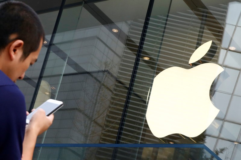 A man holds Apple smartphone outside an Apple store in Beijing, China, September 16, 2016. u00e2u20acu201d Reuters pic